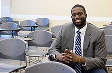 Ike Ejikeme in 2016, sitting at a desk