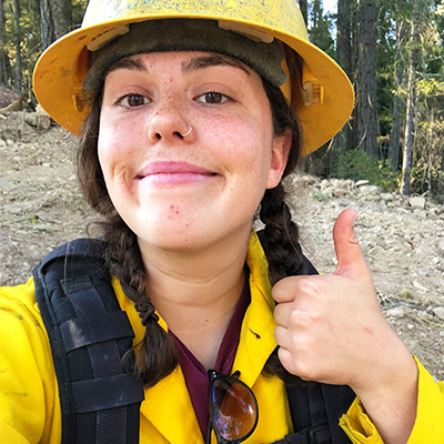 Emily Dolhansky giving a thumbs up in 2022