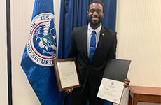 Ike Ejikeme in 2022, holding certificates