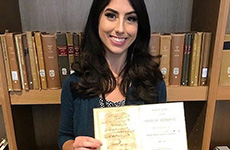 Rebecca Howard in 2022, holding a map of Tennessee