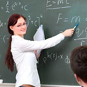 Student showing math equation on a chalk board