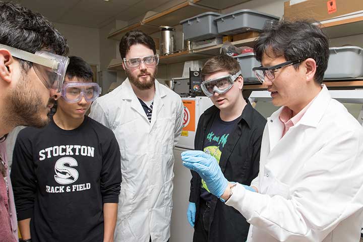 Faculty and students conducting research