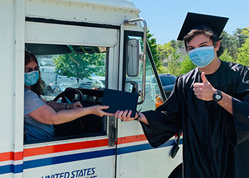 Zach Walters receives his diploma in the mail