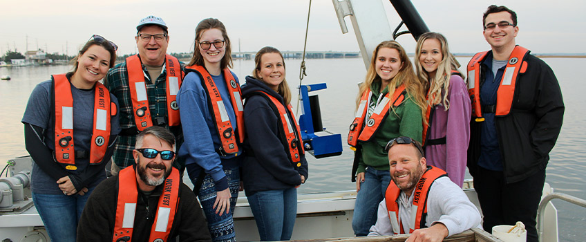 Students and professor on boat