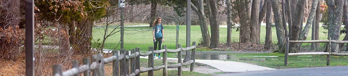 A student walking on Galloway campus