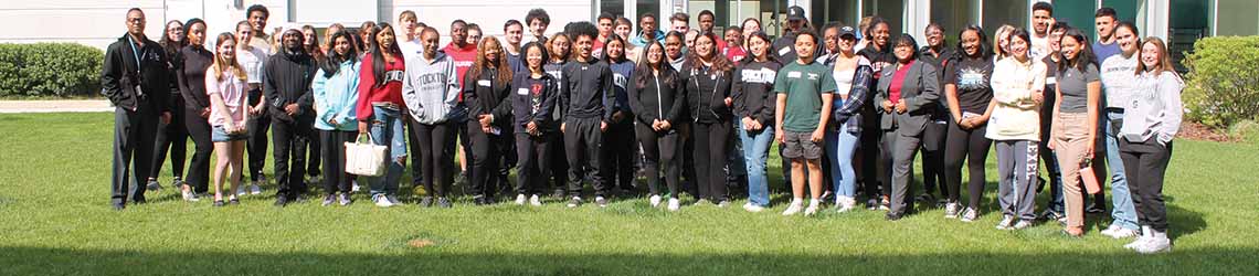 A large group of students outside for an orientation