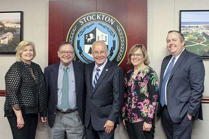 Brigid Callahan Harrison, Richard Elmore, Harvey Kesselman, Susan Davenport and Dan Nugent in front of the Stockton seal