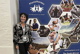 Mary Lou Galantino with physiotherapy banner