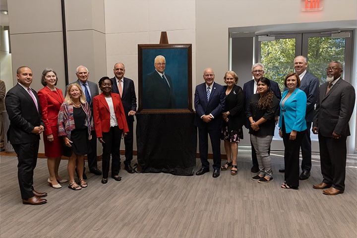 Board of Trustees members with Harvey Kesselman and his new portrait