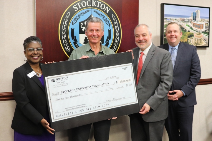 From left, Executive Vice President and Chief of Staff Terricita Sass, Alex Kaganzev, President Joe Bertolino and Dan Nugent, vice president for University Advancement and executive director of the University Foundation.