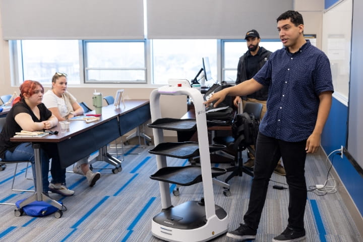 men talking to students