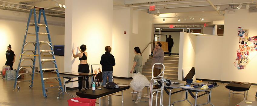 Students setting up the art gallery