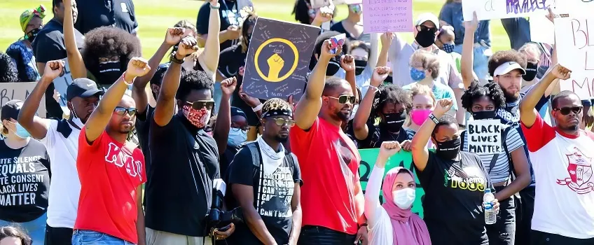 A group of Stockton students gathered outdoors for a peaceful BLACK LIVES MATTER protest.