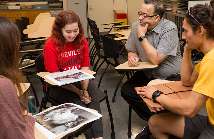 Student and Instructor discussing a photograph