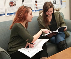 Two students collaborating in the Writing Center. 