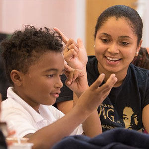 student helping a child