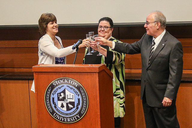 Provost, Dean and President toast.