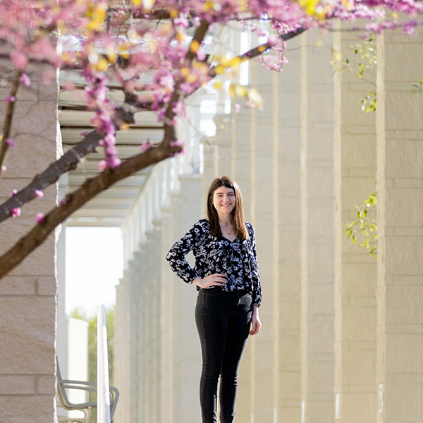 Carly Leonard, standing in front of the Campus Center