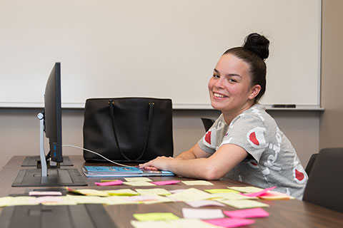 Yearbook member using a laptop