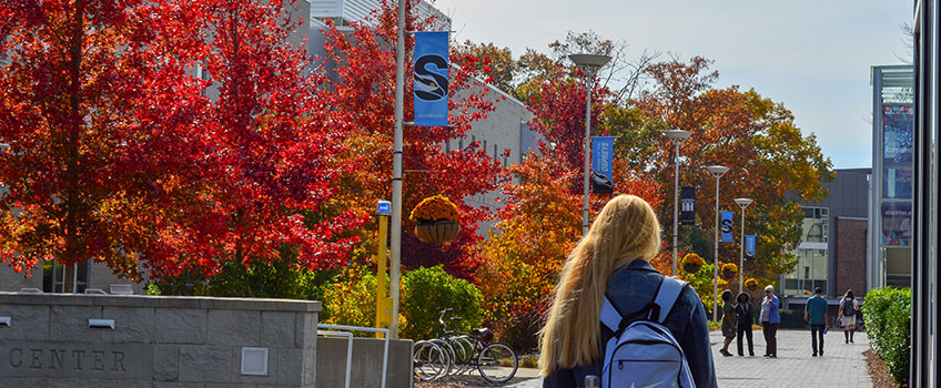 student walking on campus