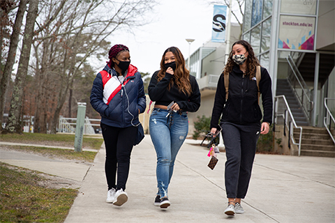 Students walking across campus in 2021