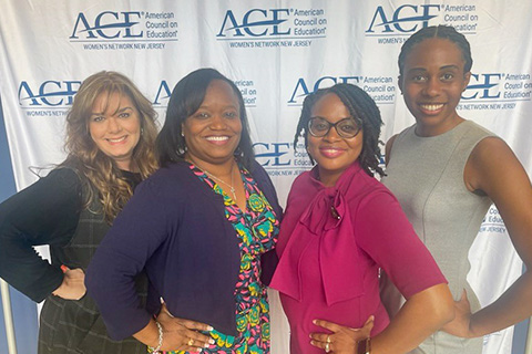 Esther Lawrence (in pink) with Stockton colleagues at a women's business event