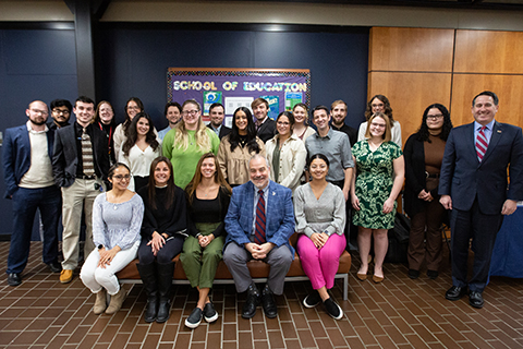 President Joe posing with students, teachers, and HESAA executive director