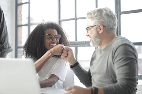 A stock image of a young woman and an older man 