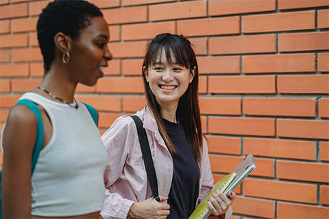 Stock image of an Asian student with friend