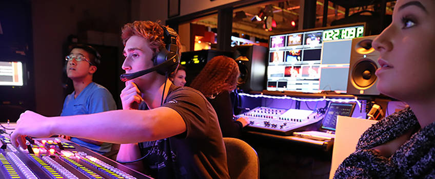 Students working in a media center