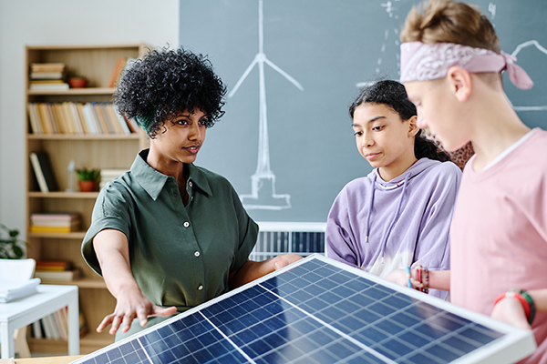teacher expaining solar panel