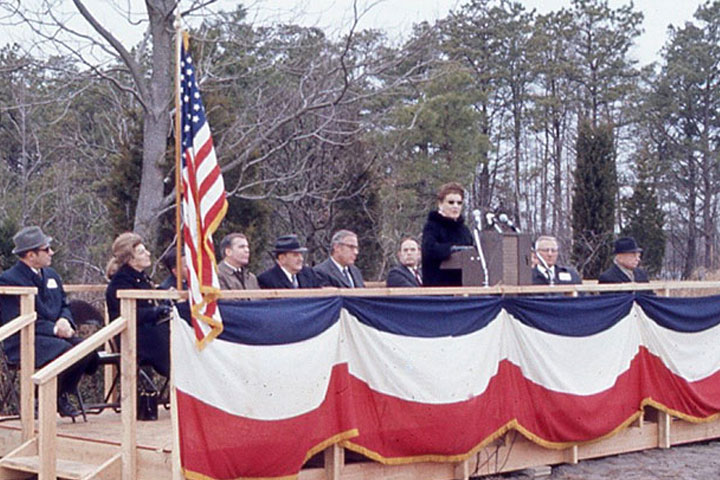 Elizabeth Alton, along with other trustees and guests, speaks at the opening of Stockton