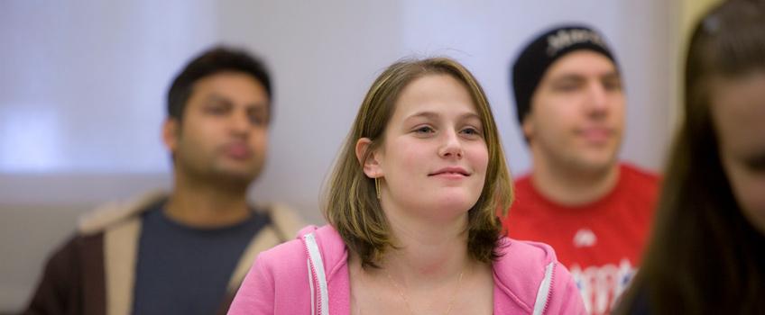 Group of students participating in a class lecture