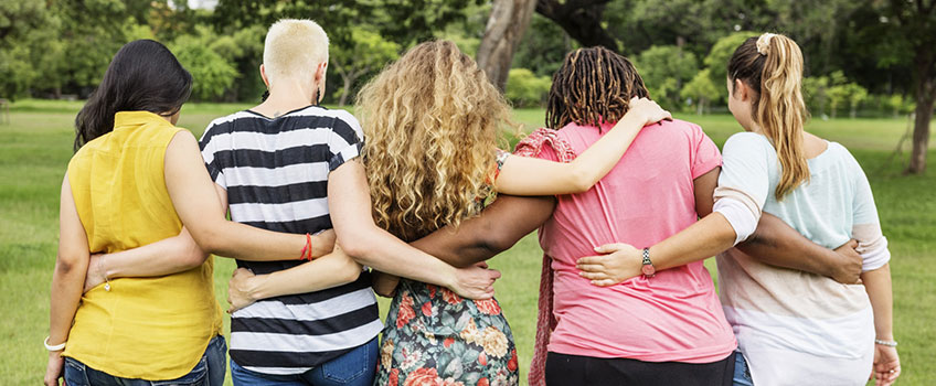 Group of females supporting each other in an embrace