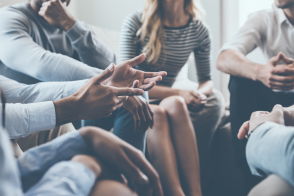 Cropped group of adults in a discussion