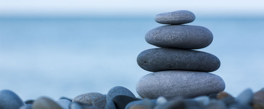 a stack of pebbles at the beach