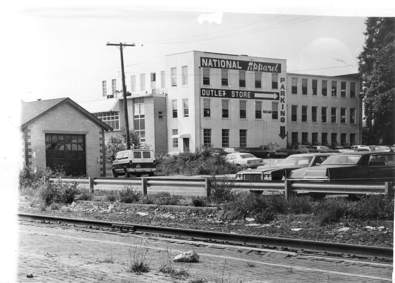 Grayscale photo depicting a factory in the 1970s