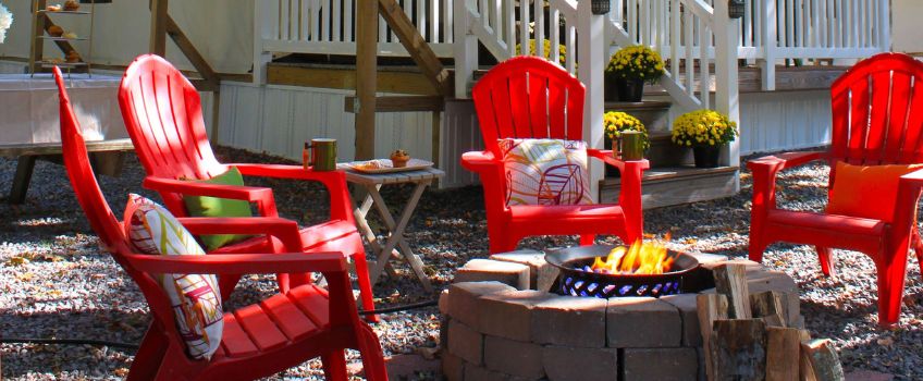 NJCOA With Permission - Red Adorondack Chairs Circling a Firepit Daytime
