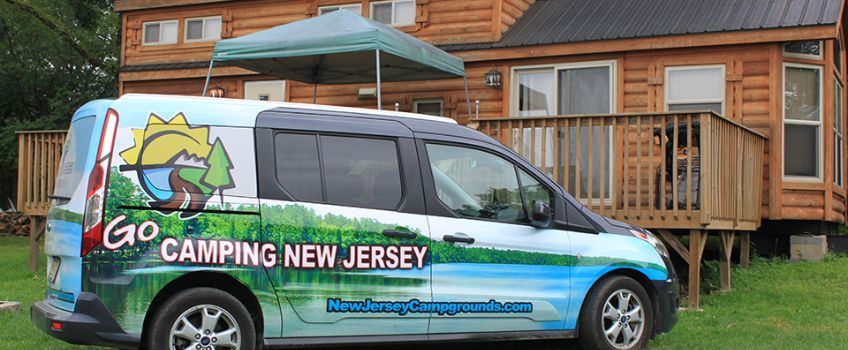 NJCOA With Permission - NJCOA Branded Van Parked In Front of Log Cabin