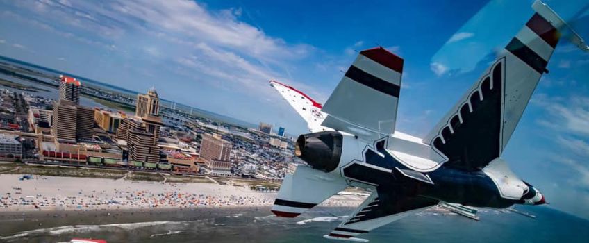 Aerial image of beach crowded with Airshow patrons with plane in the foreground, taken by an Airshow pilot. 