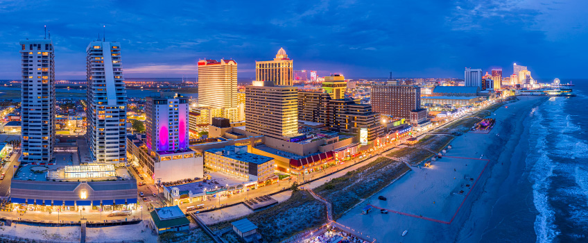 Glowing panorama of Atlantic City Boardwalk at night