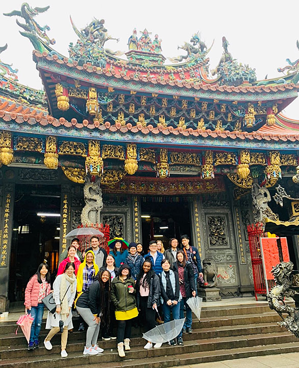 students infront of temple