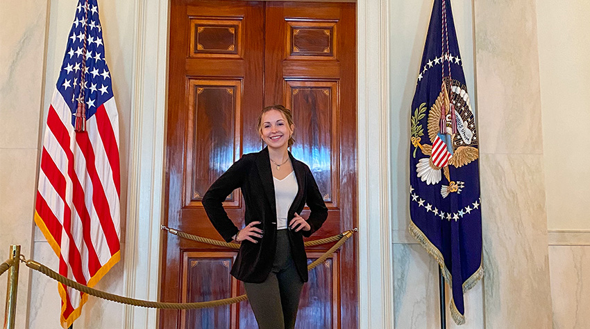 Katherine Cox in front of Presidential office