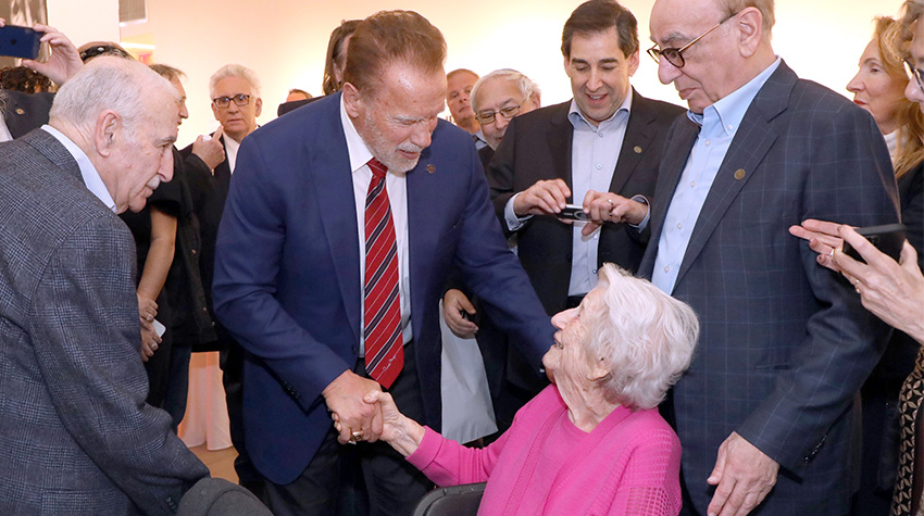 Arnold talking with Elizabeth Roth