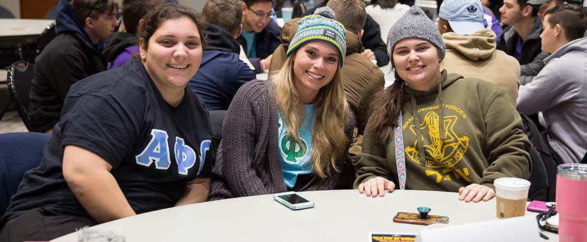 Three s female students pause for a photo during the 15th annual Martin Luther King Day of Service on Monday, Jan. 21.