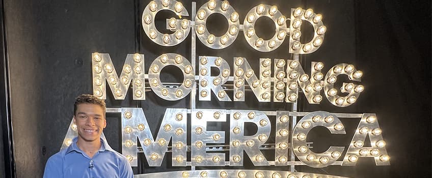 JackEdward Schmick with 'Good Morning America' sign