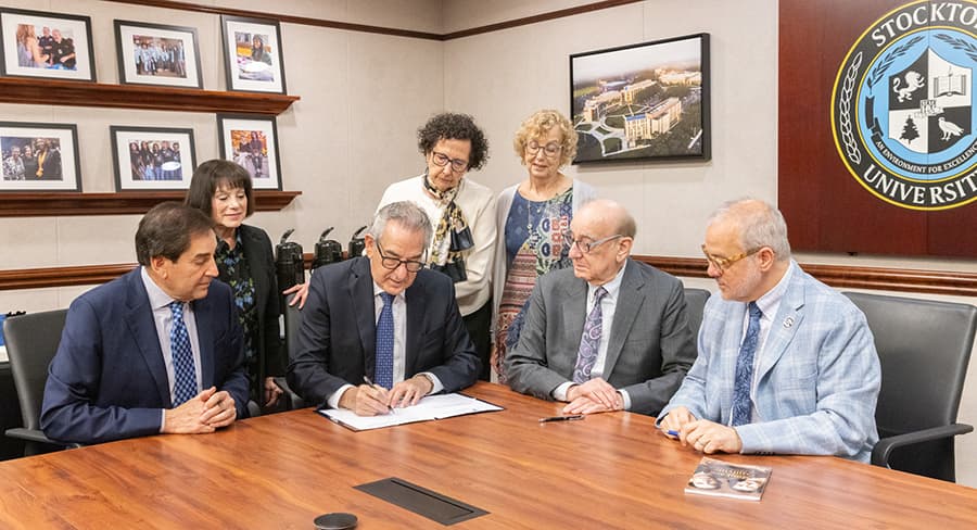 The Roth family and Stockton President Joe Bertolino