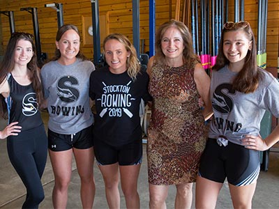 Lynne Kesselman with students from women's rowing team