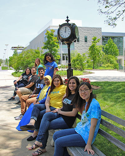 students in front of the clock