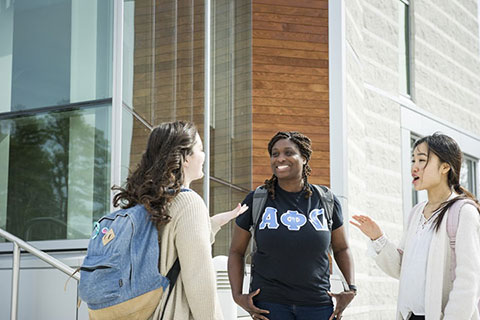 students talking outside